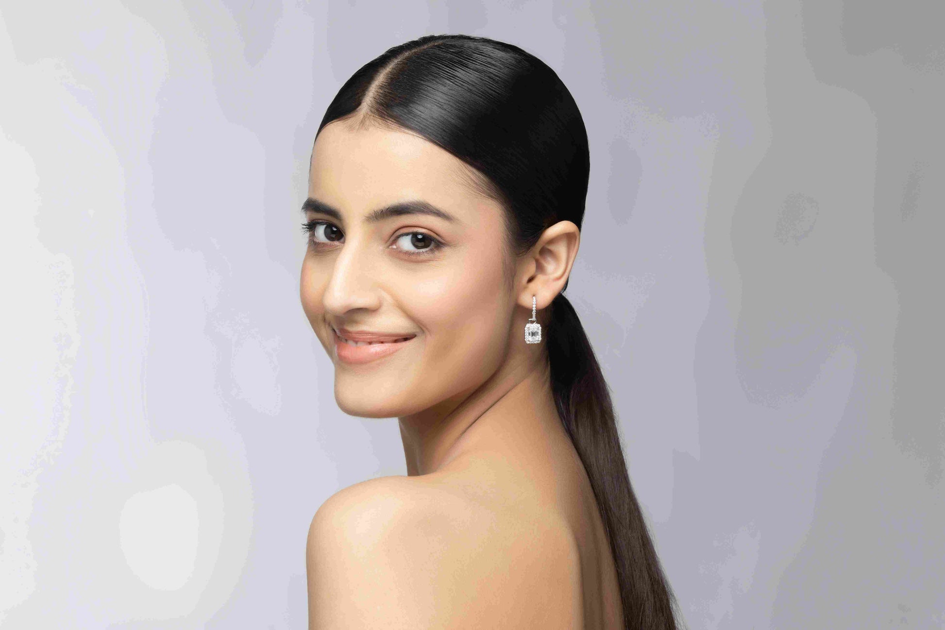 Octa 5.2 ct Solitaire Moissanite 925 Silver Drop Earrings showing intense signature rainbow fire.