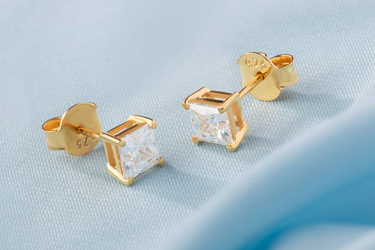 Idhani 1.0 ct Princess Cut Moissanite Prong-Set Studs in 925 Silver with intense fire.